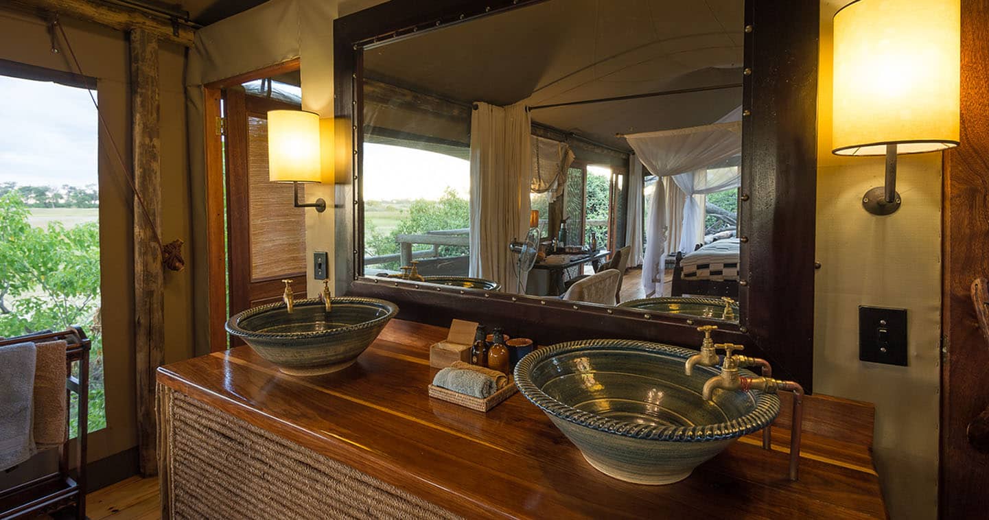 Little Vumbura Camp Bathroom in  Okavango Delta